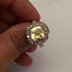 Elegant Silver and Yellow Gemstone Ring